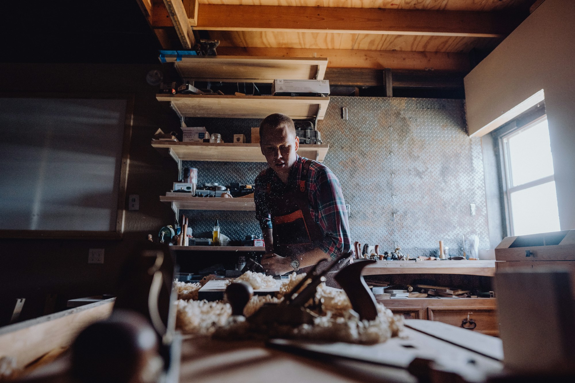 Woodworker at a workbench in a workshop